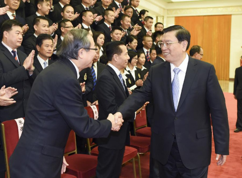 Zhang Dejiang (R, front), chairman of China's National People's Congress (NPC) Standing Committee, meets with a delegation of security units of the Hong Kong Special Administrative Region (HKSAR), in Beijing, capital of China, Oct. 9, 2015. (Xinhua/Xie Huanchi) Zhang Dejiang (R, front), chairman of China's National People's Congress (NPC) Standing Committee, meets with a delegation of security units of the Hong Kong Special Administrative Region (HKSAR), in Beijing, capital of China, Oct. 9, 2015. (Xinhua/Xie Huanchi)