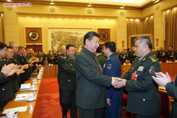 Chinese President Xi Jinping, also general secretary of the Communist Party of China Central Committee and chairman of the Central Military Commission, shakes hands with deputies to the 12th National People's Congress (NPC) from the People's Liberation Army (PLA) as he attends a plenary meeting of the PLA delegation to the NPC during the ongoing annual parliamentary session held in Beijing, capital of China, March 13, 2016.(Photo: Xinhua/Li Gang) Chinese President Xi Jinping, also general secretary of the Communist Party of China Central Committee and chairman of the Central Military Commission, shakes hands with deputies to the 12th National People's Congress (NPC) from the People's Liberation Army (PLA) as he attends a plenary meeting of the PLA delegation to the NPC during the ongoing annual parliamentary session held in Beijing, capital of China, March 13, 2016.(Photo: Xinhua/Li Gang)