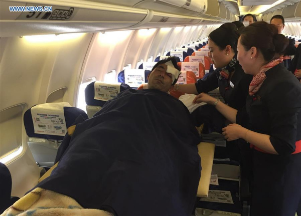A Chinese wounded is transfered on an airplane back to China in Vientiane, Laos, on March 25, 2016. Six Chinese nationals were wounded in an attack on a cross-border passenger bus in northern Laos Wednesday night, the Chinese embassy said. (Xinhua/Ren Baoguo) A Chinese wounded is transfered on an airplane back to China in Vientiane, Laos, on March 25, 2016. Six Chinese nationals were wounded in an attack on a cross-border passenger bus in northern Laos Wednesday night, the Chinese embassy said. (Xinhua/Ren Baoguo)