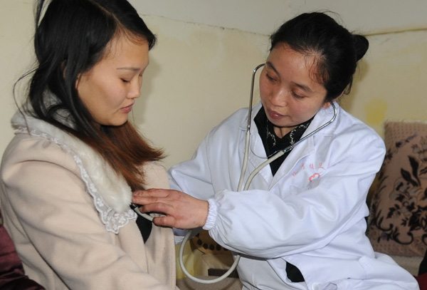 A woman who is pregnant with her second child receives a check-up in Neijiang, Sichuan province, in March. Li Jianming/ For chinadaily A woman who is pregnant with her second child receives a check-up in Neijiang, Sichuan province, in March. Li Jianming/ For chinadaily