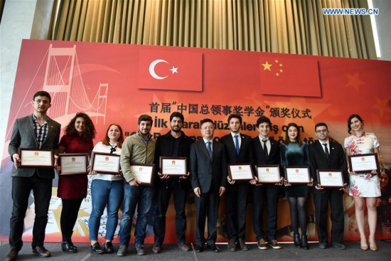 Qian Bo (C), the Chinese consul general in Istanbul, poses for a photo with students granted a scholarship at award ceremony in Istanbul, Turkey, on March 8, 2017. More than 60 Turkish students were granted a scholarship on Wednesday for their outstanding studies of the Chinese language. (Xinhua/He Canling) Qian Bo (C), the Chinese consul general in Istanbul, poses for a photo with students granted a scholarship at award ceremony in Istanbul, Turkey, on March 8, 2017. More than 60 Turkish students were granted a scholarship on Wednesday for their outstanding studies of the Chinese language. (Xinhua/He Canling)