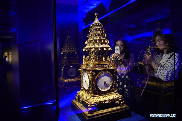 Visitors take photos of a clock on an exhibition of The Forbidden City and the Maritime Silk Road in the Palace Museum in Beijing, capital of China, May 8, 2017. A total of 140 sets of relics were on display on the exhibition. (Xinhua/Jin Liangkuai) Visitors take photos of a clock on an exhibition of The Forbidden City and the Maritime Silk Road in the Palace Museum in Beijing, capital of China, May 8, 2017. A total of 140 sets of relics were on display on the exhibition. (Xinhua/Jin Liangkuai)