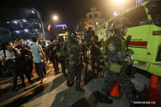 Security forces secure the surroundings of Resorts World Manila after an attack in Pasay City, the Philippines, on June 2, 2017. (Xinhua/Stringer)