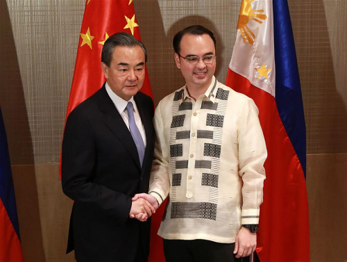 Chinese Foreign Minister Wang Yi (L) shakes hands with his Philippine counterpart Alan Peter Cayetano during their bilateral meeting in Manila, the Philippines, July 25, 2017. (Xinhua/Rouelle Umali) Chinese Foreign Minister Wang Yi (L) shakes hands with his Philippine counterpart Alan Peter Cayetano during their bilateral meeting in Manila, the Philippines, July 25, 2017. (Xinhua/Rouelle Umali)