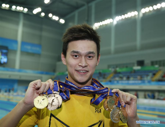 Sun Yang of Zhejiang shows all his medals after the awarding ceremony of men's 4x100m medley relay final at 13th Chinese National Games in north China's Tianjin Municipality, Sept. 7, 2017. Sun Yang won six gold medals and one silver medal at 13th Chinese National Games. (Xinhua/Fei Maohua) Sun Yang of Zhejiang shows all his medals after the awarding ceremony of men's 4x100m medley relay final at 13th Chinese National Games in north China's Tianjin Municipality, Sept. 7, 2017. Sun Yang won six gold medals and one silver medal at 13th Chinese National Games. (Xinhua/Fei Maohua)