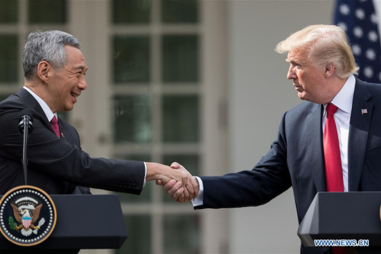 U.S. President Donald Trump (R) shakes hands with visiting Singaporean Prime Minister Lee Hsien Loong as they deliver joint statements at the White House in Washington D.C., the United States, on Oct. 23, 2017. (Xinhua/Ting Shen) U.S. President Donald Trump (R) shakes hands with visiting Singaporean Prime Minister Lee Hsien Loong as they deliver joint statements at the White House in Washington D.C., the United States, on Oct. 23, 2017. (Xinhua/Ting Shen)