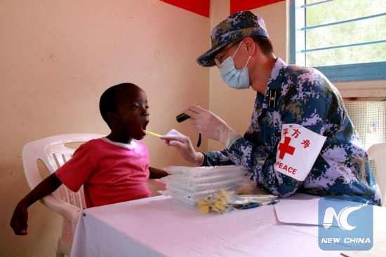 A doctor from the Chinese naval hospital ship Peace Ark examines a child at the Kurasini Children's Home in Dar es Salaam, Tanzania, Nov. 21, 2017. (Xinhua/Li Sibo) A doctor from the Chinese naval hospital ship Peace Ark examines a child at the Kurasini Children's Home in Dar es Salaam, Tanzania, Nov. 21, 2017. (Xinhua/Li Sibo)