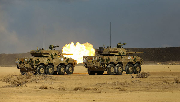 Tank destroyers from the People's Liberation Army's base in Djibouti participate in a live-fire exercise at a range in the African country's capital on Thursday. ZHANG QINGBAO/FOR CHINA DAILY Tank destroyers from the People's Liberation Army's base in Djibouti participate in a live-fire exercise at a range in the African country's capital on Thursday. ZHANG QINGBAO/FOR CHINA DAILY