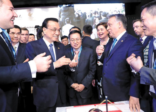 Premier Li Keqiang and Hungarian Prime Minister Viktor Orban (center, right) talk with entrepreneurs after the opening of the seventh China and the Central and Eastern European Countries Economic and Trade Forum in Budapest, Hungary, on Monday. JU PENG / XINHUA Premier Li Keqiang and Hungarian Prime Minister Viktor Orban (center, right) talk with entrepreneurs after the opening of the seventh China and the Central and Eastern European Countries Economic and Trade Forum in Budapest, Hungary, on Monday. JU PENG / XINHUA