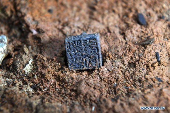 Photo taken on Jan. 25, 2018 shows the metal seal reading Liu Chongguo unearthed from the No. 5 tomb of the Marquis of Haihun site in Nanchang, east China's Jiangxi Province. Photo taken on Jan. 25, 2018 shows the metal seal reading Liu Chongguo unearthed from the No. 5 tomb of the Marquis of Haihun site in Nanchang, east China's Jiangxi Province.