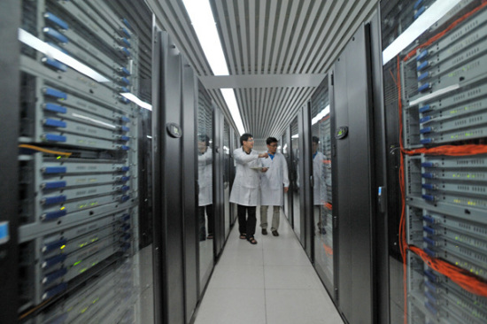 Two engineers examine the equipment of Tianhe at the National Supercomputer Center in Tianjin. (Photo provided to China Daily) Two engineers examine the equipment of Tianhe at the National Supercomputer Center in Tianjin. (Photo provided to China Daily)