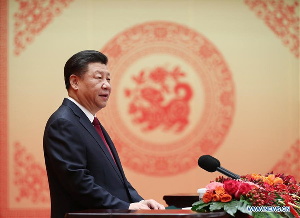 Chinese President Xi Jinping, also general secretary of the Communist Party of China (CPC) Central Committee and chairman of the Central Military Commission, delivers a speech to a festival reception at the Great Hall of the People in Beijing, capital of China, Feb. 14, 2018. Xi Jinping, on behalf of the CPC Central Committee and the State Council, extended Spring Festival greetings to all Chinese people Wednesday. (Xinhua/Ju Peng) Chinese President Xi Jinping, also general secretary of the Communist Party of China (CPC) Central Committee and chairman of the Central Military Commission, delivers a speech to a festival reception at the Great Hall of the People in Beijing, capital of China, Feb. 14, 2018. Xi Jinping, on behalf of the CPC Central Committee and the State Council, extended Spring Festival greetings to all Chinese people Wednesday. (Xinhua/Ju Peng)