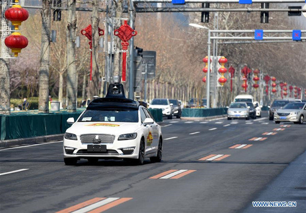 A self-driving vehicle for public road testing runs on a road in Beijing, capital of China, March 22, 2018. Beijing released its first temporary license plates for Baidu's self-driving vehicles for public road testing on Thursday. The capital city has opened 33 roads with a total length of 105 kilometers for autonomous car testing outside the Fifth Ring Road and away from densely-populated areas on the outskirts. (Xinhua/Luo Xiaoguang) A self-driving vehicle for public road testing runs on a road in Beijing, capital of China, March 22, 2018. Beijing released its first temporary license plates for Baidu's self-driving vehicles for public road testing on Thursday. The capital city has opened 33 roads with a total length of 105 kilometers for autonomous car testing outside the Fifth Ring Road and away from densely-populated areas on the outskirts. (Xinhua/Luo Xiaoguang)