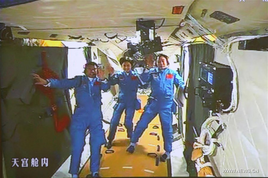 Photo taken on June 18, 2012 shows the screen at the Beijing Aerospace Control Center showing Chinese astronauts Jing Haipeng, Liu Wang and Liu Yang at the orbiting Tiangong-1 space lab module. (Xinhua/Zha Chunming) Photo taken on June 18, 2012 shows the screen at the Beijing Aerospace Control Center showing Chinese astronauts Jing Haipeng, Liu Wang and Liu Yang at the orbiting Tiangong-1 space lab module. (Xinhua/Zha Chunming)