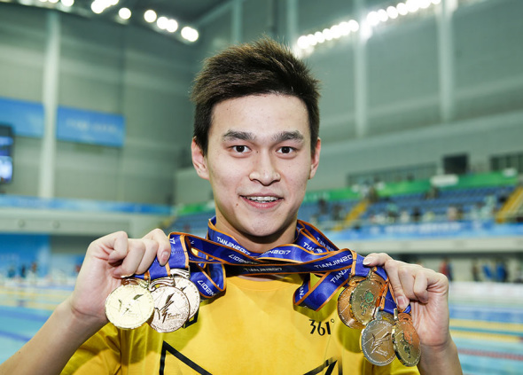 World and Olympic champion Sun Yang, displaying the six gold medals and one silver he won at the China National Games last September in Tianjin, is the one to watch when the China National Swimming Championships open on Friday in Taiyuan. (Photo/Xinhua) World and Olympic champion Sun Yang, displaying the six gold medals and one silver he won at the China National Games last September in Tianjin, is the one to watch when the China National Swimming Championships open on Friday in Taiyuan. (Photo/Xinhua)