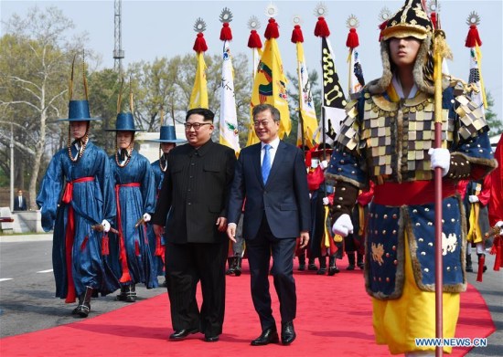 South Korean President Moon Jae-in (R) meets with top leader of the Democratic People's Republic of Korea (DPRK) Kim Jong Un in the border village of Panmunjom on April 27, 2018. Moon Jae-in arrived Friday morning in the border village of Panmunjom for his first summit with Kim Jong Un. (Xinhua/Inter-Korean Summit Press Corps)