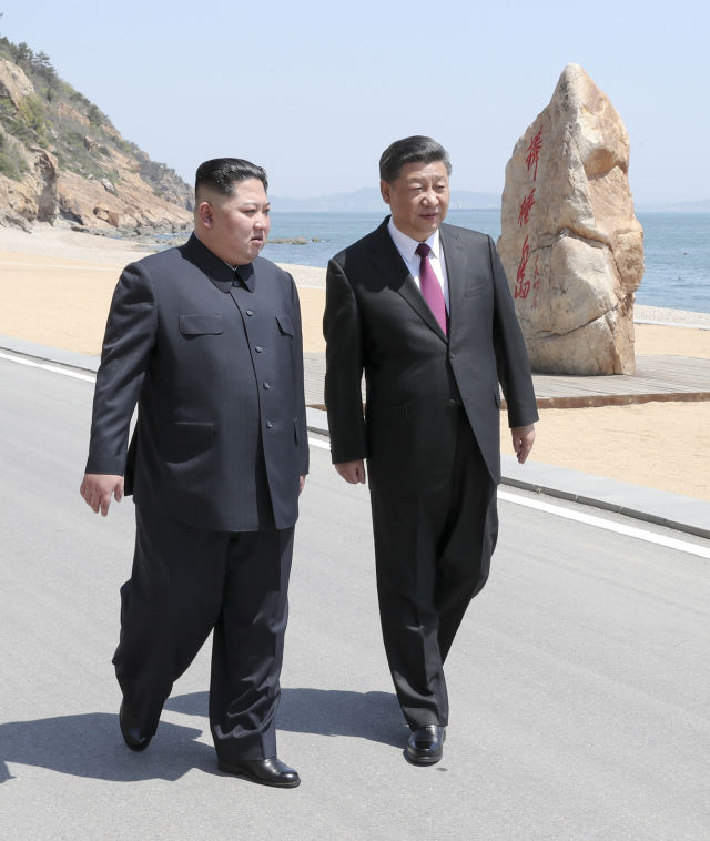 Xi Jinping (R), general secretary of the Central Committee of the Communist Party of China (CPC) and Chinese president, holds talks with Kim Jong Un, chairman of the Workers' Party of Korea (WPK) and chairman of the State Affairs Commission of the Democratic People's Republic of Korea (DPRK), in Dalian, northeast China's Liaoning Province, on May 7-8. (Xinhua/Xie Huanchi) Xi Jinping (R), general secretary of the Central Committee of the Communist Party of China (CPC) and Chinese president, holds talks with Kim Jong Un, chairman of the Workers' Party of Korea (WPK) and chairman of the State Affairs Commission of the Democratic People's Republic of Korea (DPRK), in Dalian, northeast China's Liaoning Province, on May 7-8. (Xinhua/Xie Huanchi)