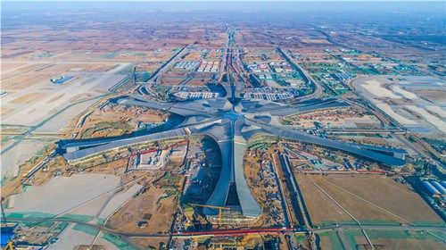 An aerial photo shows the construction site of Beijing's new airport in southern Daxing district in Beijing. (Photo by Yang Zhiyong/chinadaily.com.cn) An aerial photo shows the construction site of Beijing's new airport in southern Daxing district in Beijing. (Photo by Yang Zhiyong/chinadaily.com.cn)