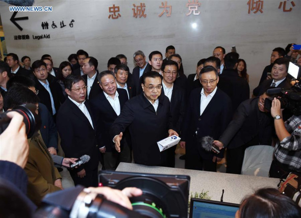 Chinese Premier Li Keqiang (C) visits an administrative service center in Lujiazui Area in Shanghai, east China, Nov. 25, 2015. Li had an inspection tour in the Shanghai Free Trade Zone (FTZ) on Wednesday. (Photo: Xinhua/Rao Aimin) Chinese Premier Li Keqiang (C) visits an administrative service center in Lujiazui Area in Shanghai, east China, Nov. 25, 2015. Li had an inspection tour in the Shanghai Free Trade Zone (FTZ) on Wednesday. (Photo: Xinhua/Rao Aimin)