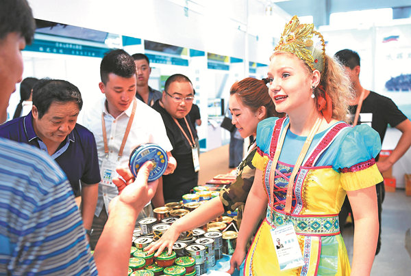Visitors to the ChinaRussia Expo in Harbin, capital of Heilongjiang province, check goods from Russia in June last year. The province has close trade ties with Russia, which it borders on. WANG JIANWEI / XINHUA Visitors to the ChinaRussia Expo in Harbin, capital of Heilongjiang province, check goods from Russia in June last year. The province has close trade ties with Russia, which it borders on. WANG JIANWEI / XINHUA