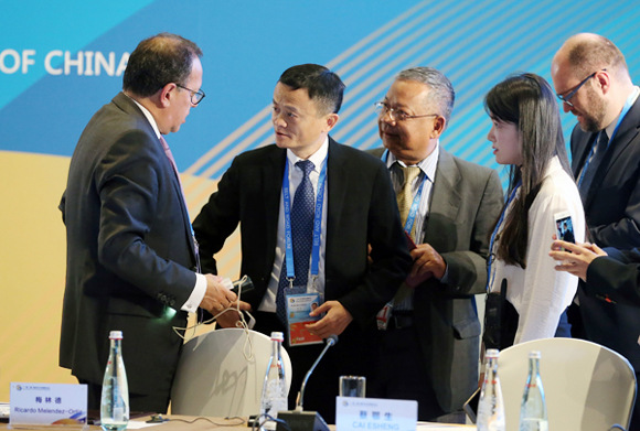 Alibaba founder and Chairman Jack Ma (second from left) talks with Ricardo Melendez-Ortiz, chief executive of the International Centre for Trade and Sustainable Development, at the forum on Sunday. (WANG ZHUANGFEI / CHINA DAILY) Alibaba founder and Chairman Jack Ma (second from left) talks with Ricardo Melendez-Ortiz, chief executive of the International Centre for Trade and Sustainable Development, at the forum on Sunday. (WANG ZHUANGFEI / CHINA DAILY)