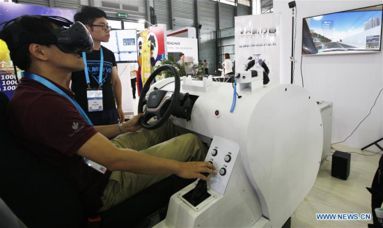 A visitor tries a virtual driving system that can be used by driving schools during the 2017 CES (Consumer Electronics Show) Asia in Shanghai, east China, June 7, 2017. (Xinhua/Fang Zhe) A visitor tries a virtual driving system that can be used by driving schools during the 2017 CES (Consumer Electronics Show) Asia in Shanghai, east China, June 7, 2017. (Xinhua/Fang Zhe)