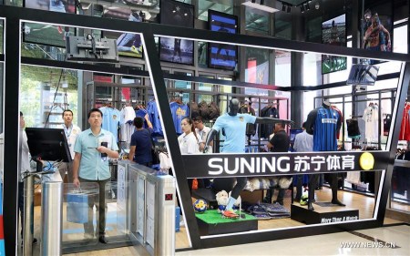 Customers purchase goods at an unmanned store of China's e-commerce platform Suning Appliance in Nanjing, capital of east China's Jiangsu Province, Aug. 28, 2017. The unmanned store, which recognizes customers' identity through face recognition system, is able to automatically collect money from customers when they take commodities to pass through a payment gateway. The money collection is realized with Suning-bolstered financial system. (Xinhua/Li Yuze) Customers purchase goods at an unmanned store of China's e-commerce platform Suning Appliance in Nanjing, capital of east China's Jiangsu Province, Aug. 28, 2017. The unmanned store, which recognizes customers' identity through face recognition system, is able to automatically collect money from customers when they take commodities to pass through a payment gateway. The money collection is realized with Suning-bolstered financial system. (Xinhua/Li Yuze)