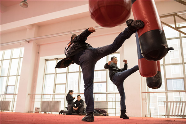 New team members work out at a training facility. (Photo by Zhou Gangfeng/For China Daily) New team members work out at a training facility. (Photo by Zhou Gangfeng/For China Daily)