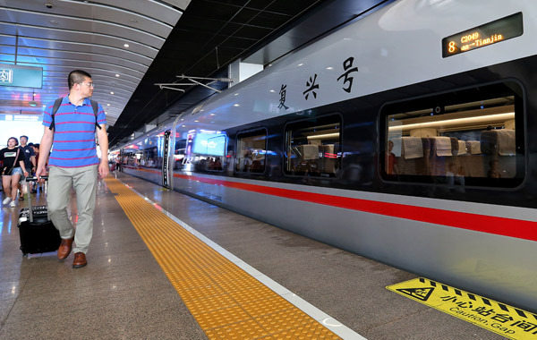 A new Fuxing bullet train running between Tianjin and Beijing, prepares to leave the capital. (Photo/China Daily) A new Fuxing bullet train running between Tianjin and Beijing, prepares to leave the capital. (Photo/China Daily)