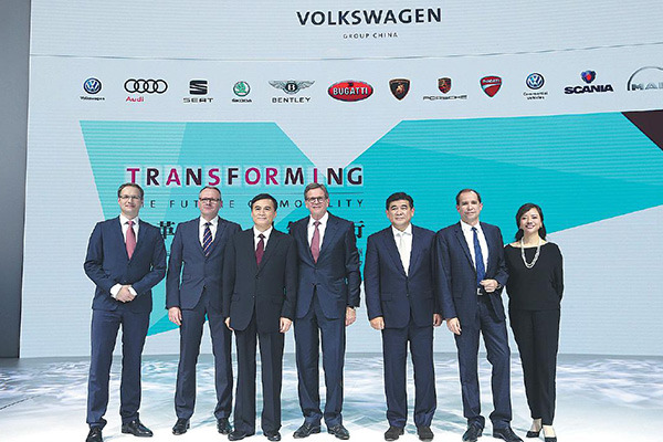 Executives from Volkswagen Group China and partner JAC Motors pose for a photo at the Guangzhou auto show. (Photo provided to China Daily) Executives from Volkswagen Group China and partner JAC Motors pose for a photo at the Guangzhou auto show. (Photo provided to China Daily)
