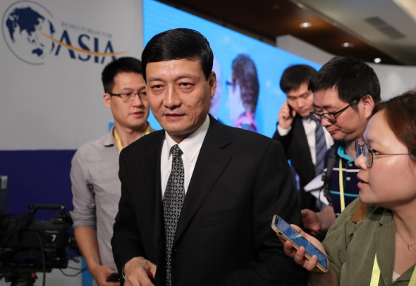 Xiao Yaqing, chairman of the State-owned Assets Supervision and Administration Commission, preparing to address the panel discussion at the Boao Forum for Asia Annual Conference 2018 in Boao, Hainan province, on Wednesday. (Photo provided to China Daily) Xiao Yaqing, chairman of the State-owned Assets Supervision and Administration Commission, preparing to address the panel discussion at the Boao Forum for Asia Annual Conference 2018 in Boao, Hainan province, on Wednesday. (Photo provided to China Daily)