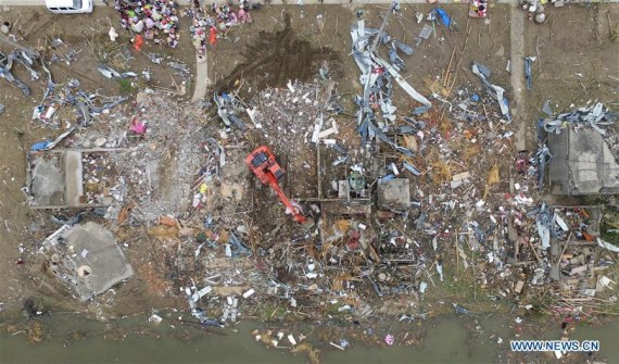 An excavator works in debris in Beichen Village of Funing County, east China's Jiangsu Province, June 24, 2016. (Photo: Xinhua/Ding Ting) An excavator works in debris in Beichen Village of Funing County, east China's Jiangsu Province, June 24, 2016. (Photo: Xinhua/Ding Ting)