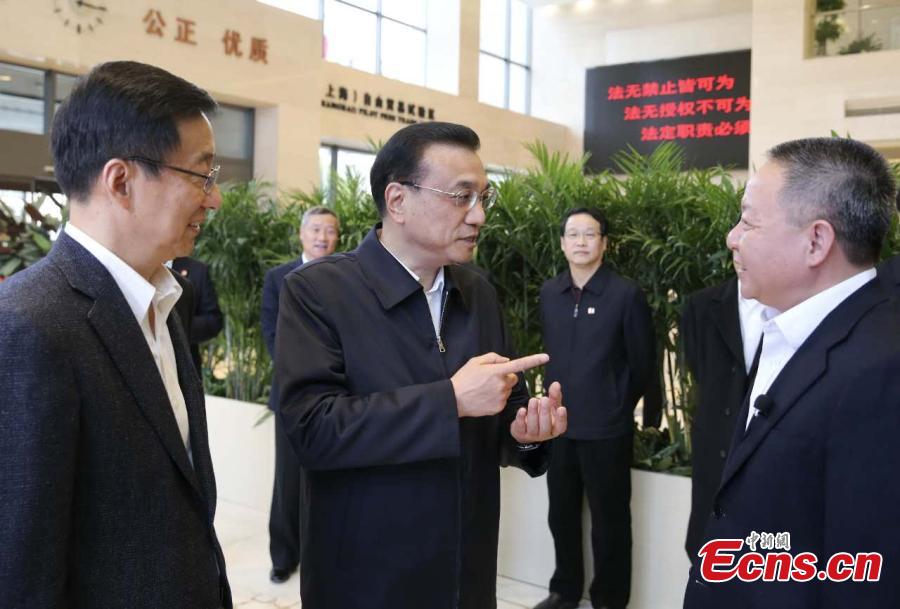Li stresses reform, opening up during visit to Shanghai FTZ(1/6)