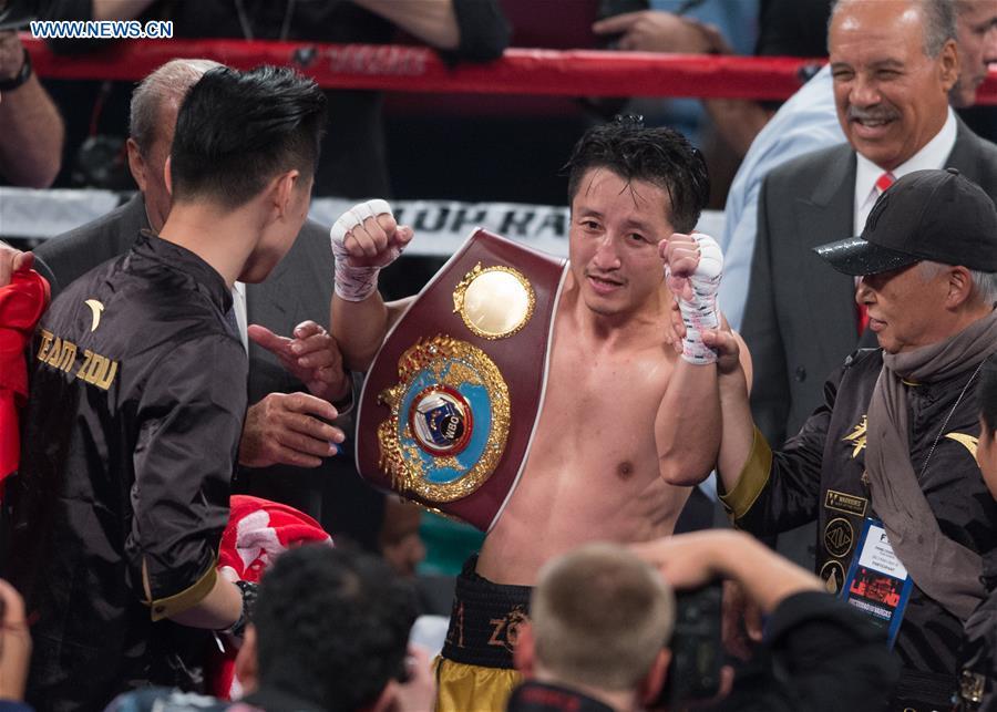 Zou Shiming wins WBO flyweight title boxing match in Las Vegas(1/8)