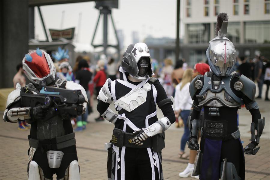 People dressed in costumes pose for a photo at the MCM Comic Con at the ExCel center in London, Britain, on May 27, 2018. The MCM Comic Con was held in London from May 25 to May 27, attacting lots of comic fans to the popular culture gathering. (Xinhua/Tim Ireland)