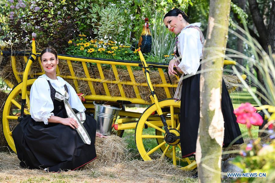 Two women pose during the 53rd Floraart International Garden Exhibition in Zagreb, capital of Croatia, May 28, 2018. The exhibition lasts from May 28 to June 3. (Xinhua/ Sandra Simunovic)