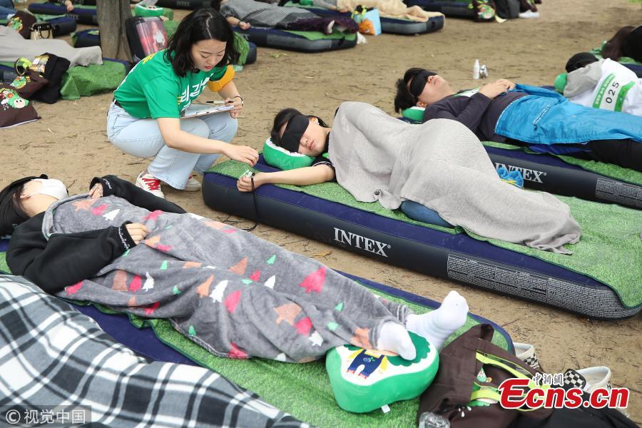 A sleeping contest is held in Seoul Forest in South Korea, May 27, 2018. More than 8,500 people applied to join the contest for its third edition, with the longest sleeper the winner. (Photo/VCG)