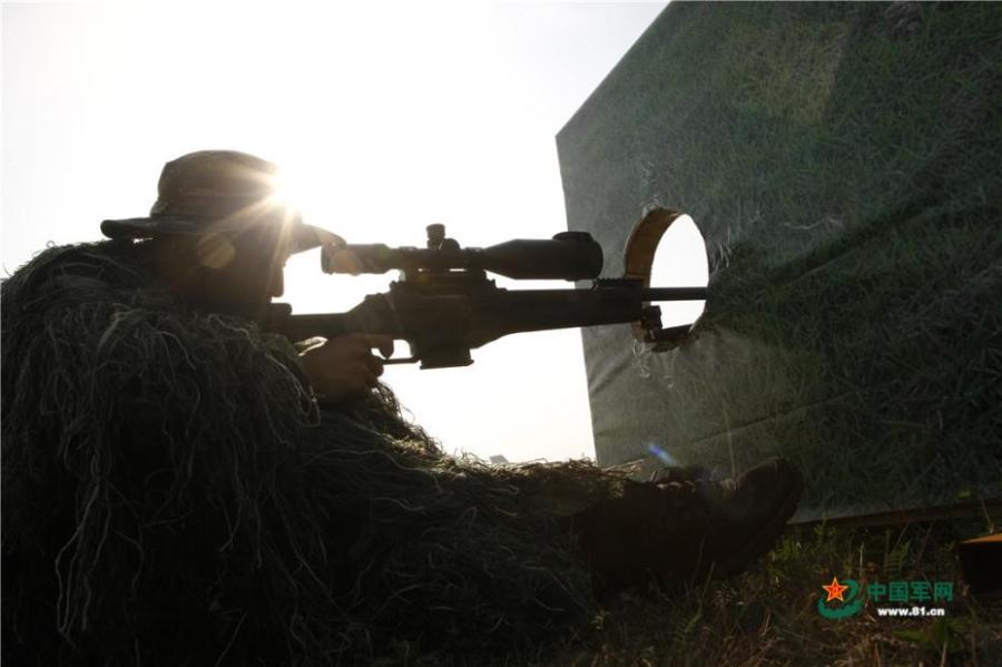 Photo taken on May 28, 2018 at the Great Wall 2018 Anti-terror International Forum shows Special Police of China members demonstrating anti-terror training programs at the Special Police Academy of the Chinese People\'s Armed Police Force in Beijing. The training included shooting and forced airplane cabin entry. (Photo/81.cn)
