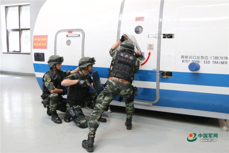 Photo taken on May 28, 2018 at the Great Wall 2018 Anti-terror International Forum shows Special Police of China members demonstrating anti-terror training programs at the Special Police Academy of the Chinese People\'s Armed Police Force in Beijing. The training included shooting and forced airplane cabin entry. (Photo/81.cn)