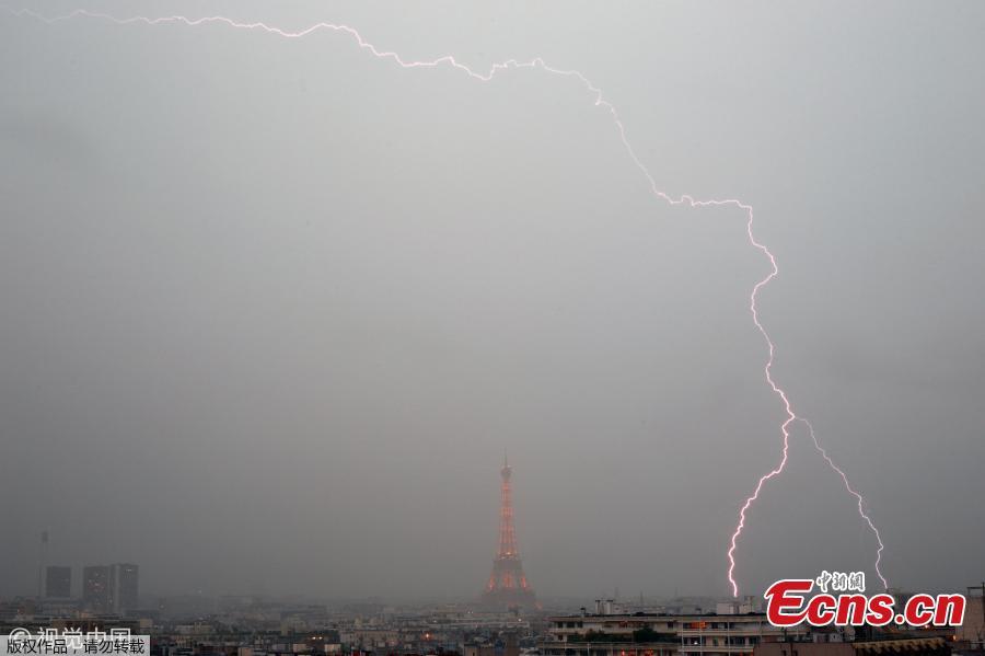 The Eiffel Tower is pictured as heavy rain hits Paris, France, May 28, 2019. (Photo/VCG)