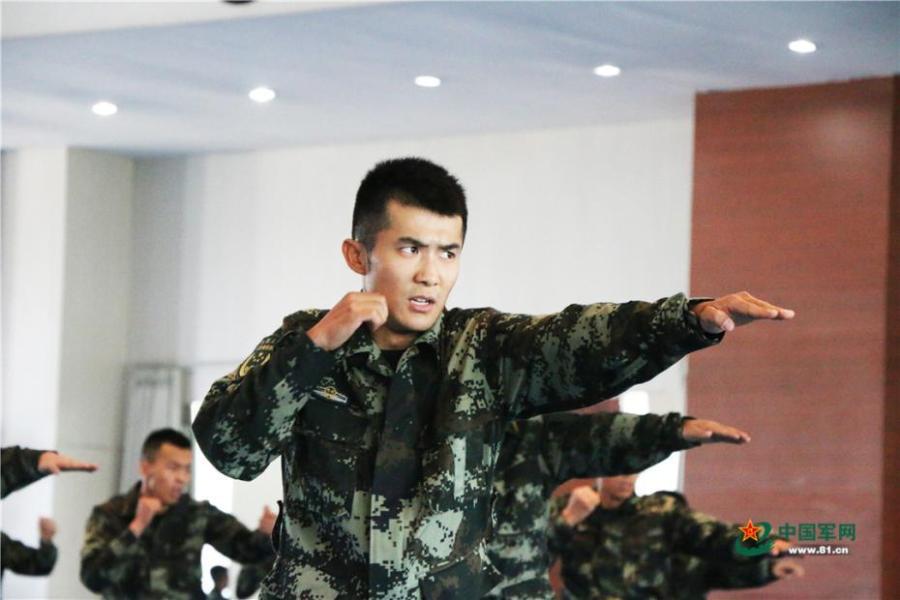 Photo taken on May 28, 2018 at the Great Wall 2018 Anti-terror International Forum shows Special Police of China members demonstrating anti-terror training programs at the Special Police Academy of the Chinese People\'s Armed Police Force in Beijing. The training included shooting and forced airplane cabin entry. (Photo/81.cn)