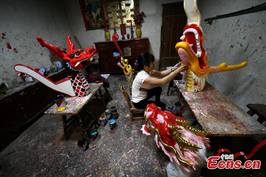 Heads of dragon boats are painted at a factory in Fangzhuang Village, Minhou County, East China’s Fujian Province, May 30, 2018. The village has a 700-year history of dragon-boat making. As fewer young people work to inherit the skills of the traditional craft, the village is now home to just four factories still using ancient simple tools to make the handmade boats. The Dragon Boat Festival is celebrated on the fifth day of the fifth month of the Chinese lunar calendar and falls on June 18 this year. (Photo: China News Service/Wang Dongming)