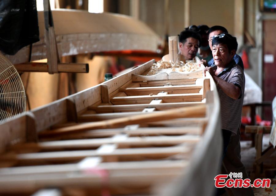 Workers make a dragon boat at a factory in Fangzhuang Village, Minhou County, East China’s Fujian Province, May 30, 2018. The village has a 700-year history of dragon-boat making. As fewer young people work to inherit the skills of the traditional craft, the village is now home to just four factories still using ancient simple tools to make the handmade boats. The Dragon Boat Festival is celebrated on the fifth day of the fifth month of the Chinese lunar calendar and falls on June 18 this year. (Photo: China News Service/Wang Dongming)