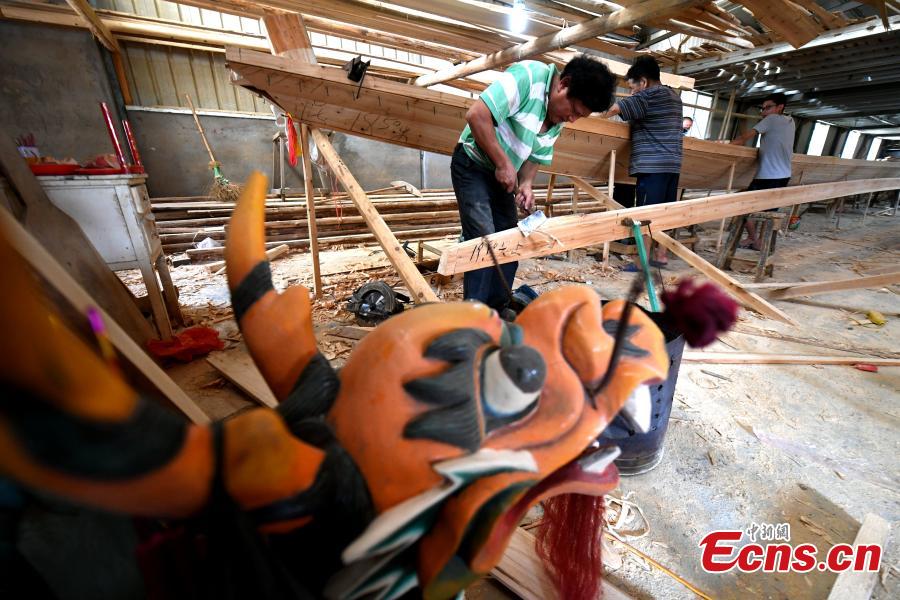Workers make a dragon boat at a factory in Fangzhuang Village, Minhou County, East China’s Fujian Province, May 30, 2018. The village has a 700-year history of dragon-boat making. As fewer young people work to inherit the skills of the traditional craft, the village is now home to just four factories still using ancient simple tools to make the handmade boats. The Dragon Boat Festival is celebrated on the fifth day of the fifth month of the Chinese lunar calendar and falls on June 18 this year. (Photo: China News Service/Wang Dongming)