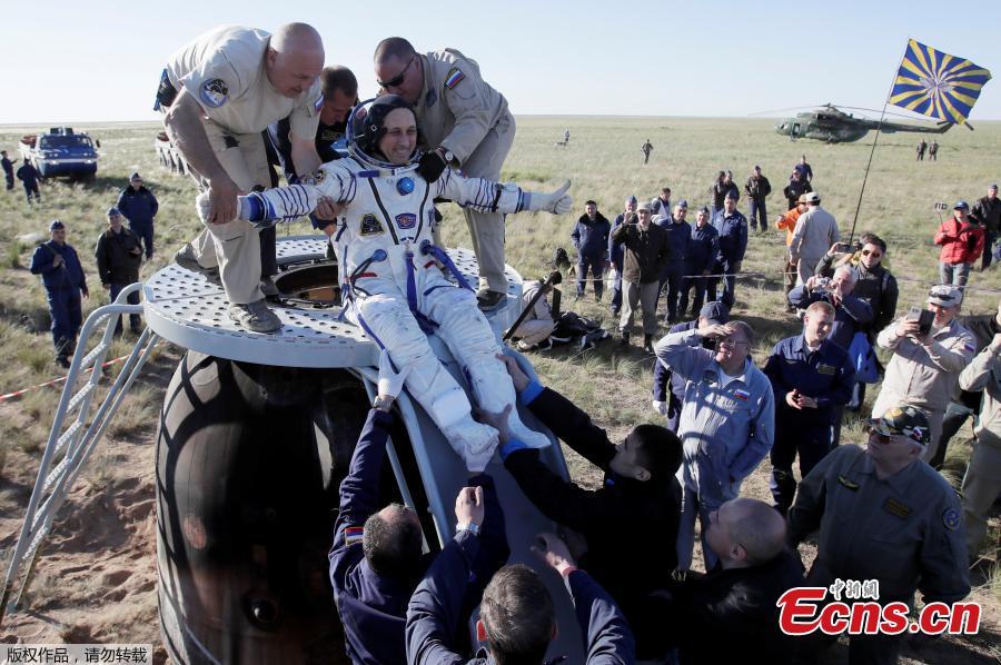 Ground personnel help International Space Station crew member Anton Shkaplerov of Russia to get out of the Soyuz MS-07 space capsule shortly after landing in a remote area outside the town of Dzhezkazgan, Kazakhstan June 3, 2018. (Photo/Agencies)