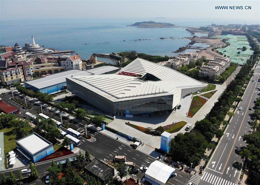 Aerial photo shows the media center of the 18th Shanghai Cooperation Organization (SCO) Summit in Qingdao, east China\'s Shandong Province, June 3, 2018. The media center of the 18th SCO Summit will open to journalists from both home and abroad on June 6, the organizer said on Sunday. (Xinhua/Li Ziheng)