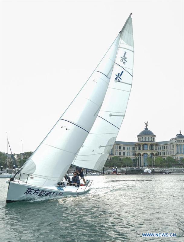 A sailboat is seen in the water in Qingdao, east China\'s Shandong Province, June 4, 2018. The 18th Shanghai Cooperation Organization (SCO) Summit is scheduled for June 9 to 10 in Qingdao. (Xinhua/Yin Gang)
