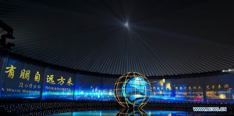 A lights and fireworks show takes place in Qingdao, the host city of the 18th Shanghai Cooperation Organization (SCO) summit, in east China\'s Shandong Province, June 9, 2018. (Xinhua/Li Xueren)