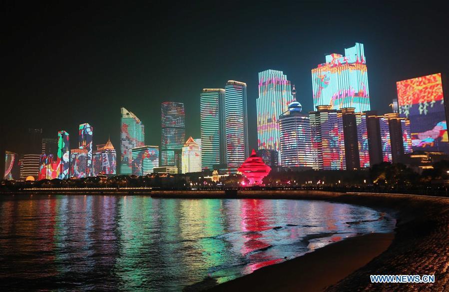 A lights and fireworks show takes place in Qingdao, the host city of the 18th Shanghai Cooperation Organization (SCO) summit, in east China\'s Shandong Province, June 9, 2018. (Xinhua/Jiang Kehong)