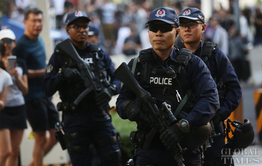 Singaporean police on patrol to ensure the security outside the St. Regis hotel where DPRK leader Kim Jong-un has stayed on Sunday. (Photo: Yang Sheng/GT)